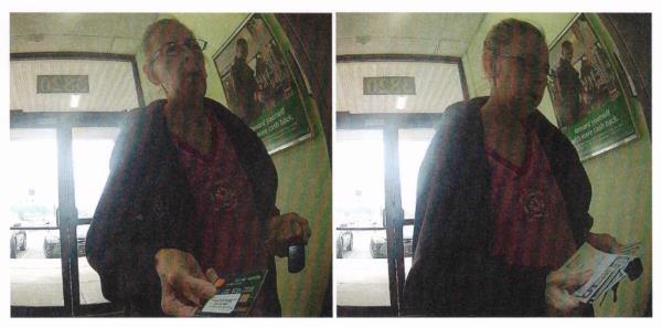 Wendy Stone pictured using Crisman's debit card at an ATM to make  cash withdrawals.