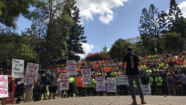 A speaker addresses the CFMEU rally in Brisbane’s Emma Miller Place.